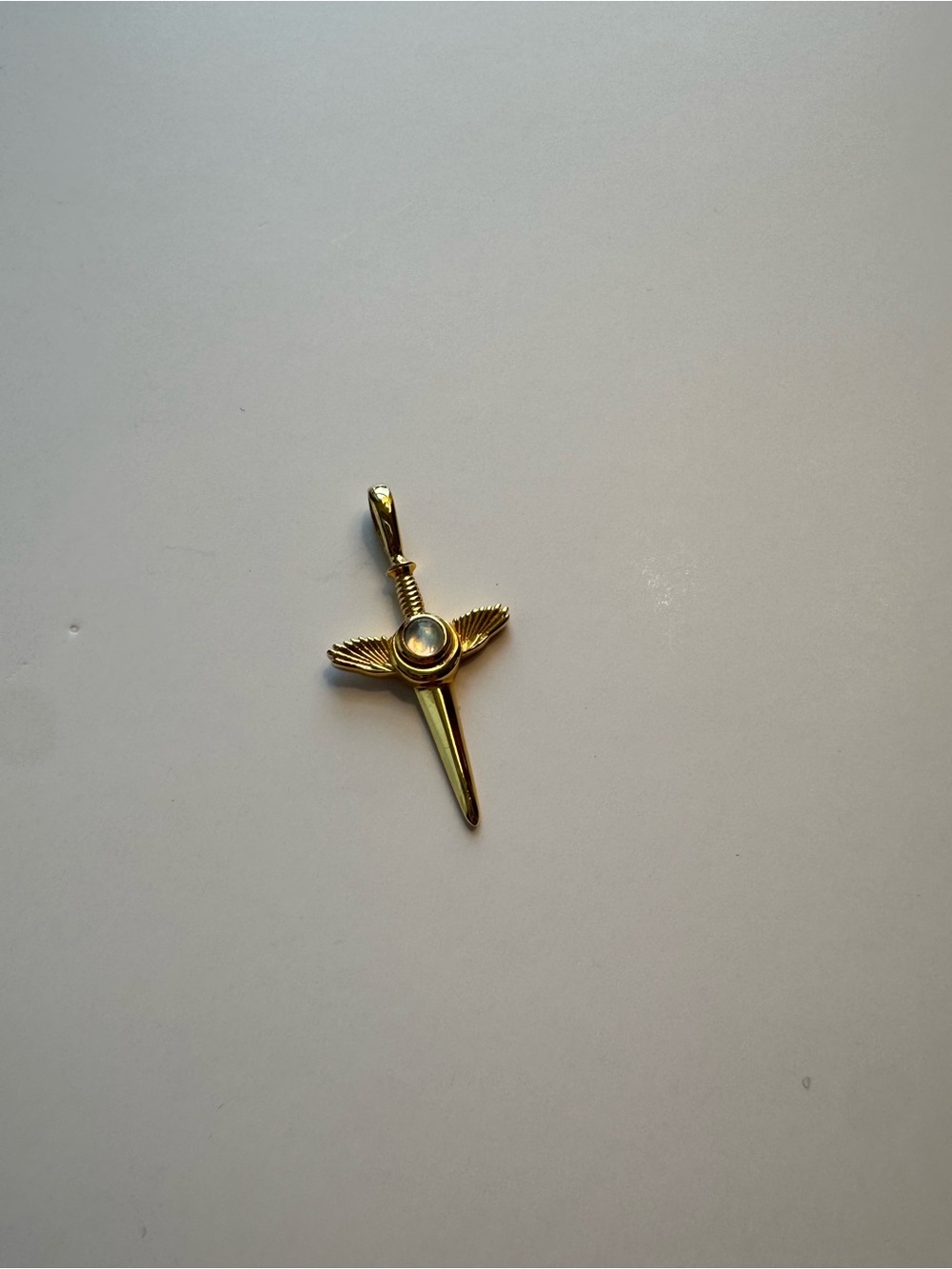 Awe Inspired flying dagger amulet charm with moonstone